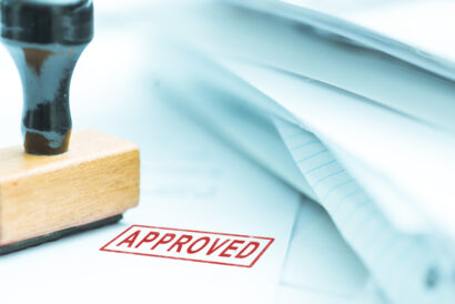 approved approved documents or project, shallow depth of field, focus on stamp